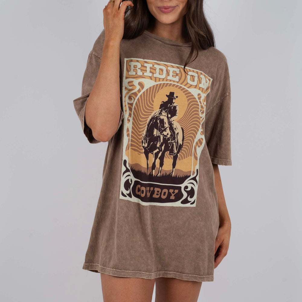 
                      
                        Ride On Cowboy Graphic Tee
                      
                    