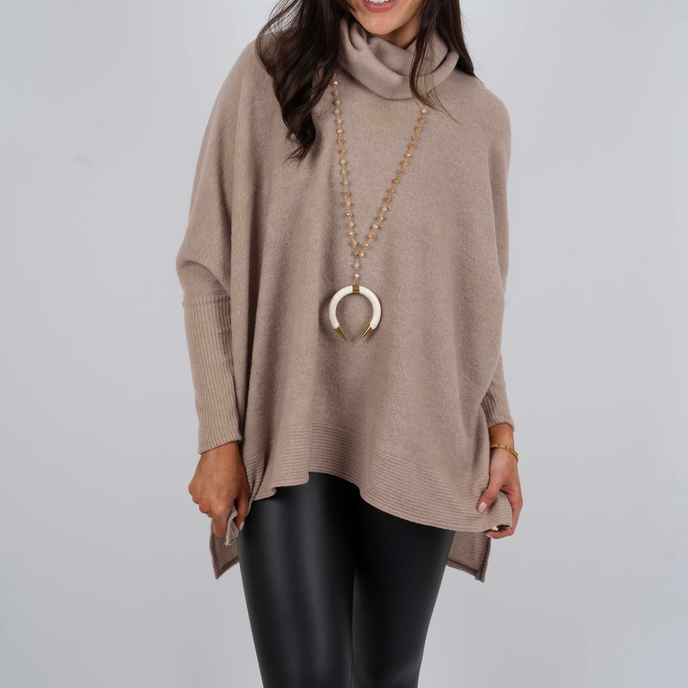 
                      
                        Tell Me Why Tunic (Taupe)
                      
                    