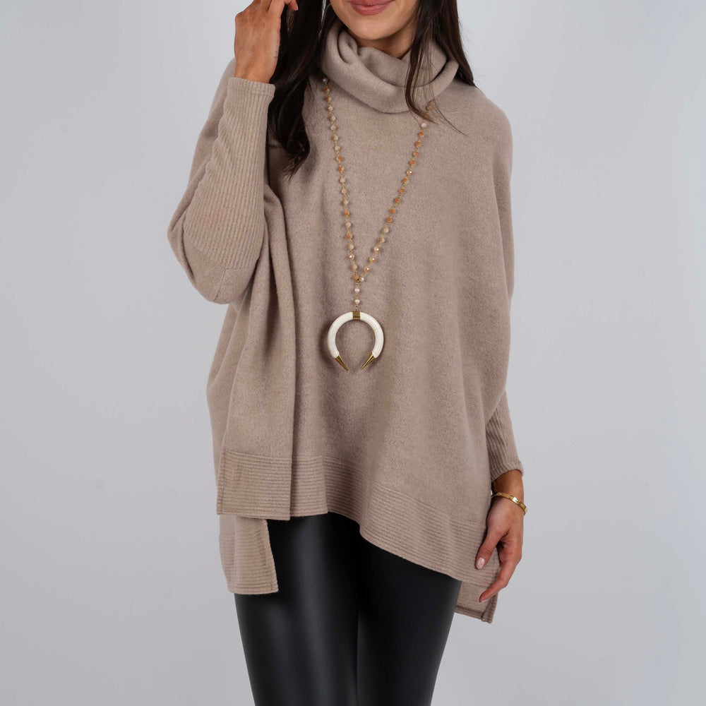 
                      
                        Tell Me Why Tunic (Taupe)
                      
                    